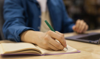 boy-studying-in-the-university-library