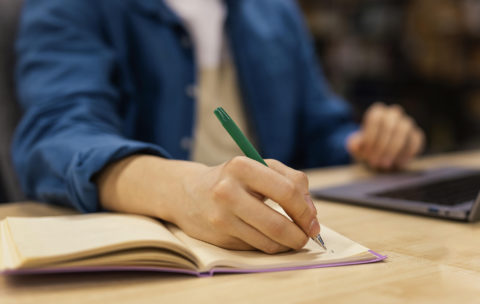 boy-studying-in-the-university-library